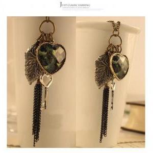 Love Peacock Feather Leaves Key Tassel Necklace..