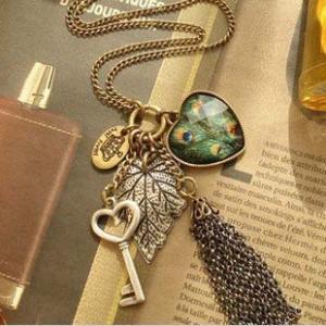 Love Peacock Feather Leaves Key Tassel Necklace..